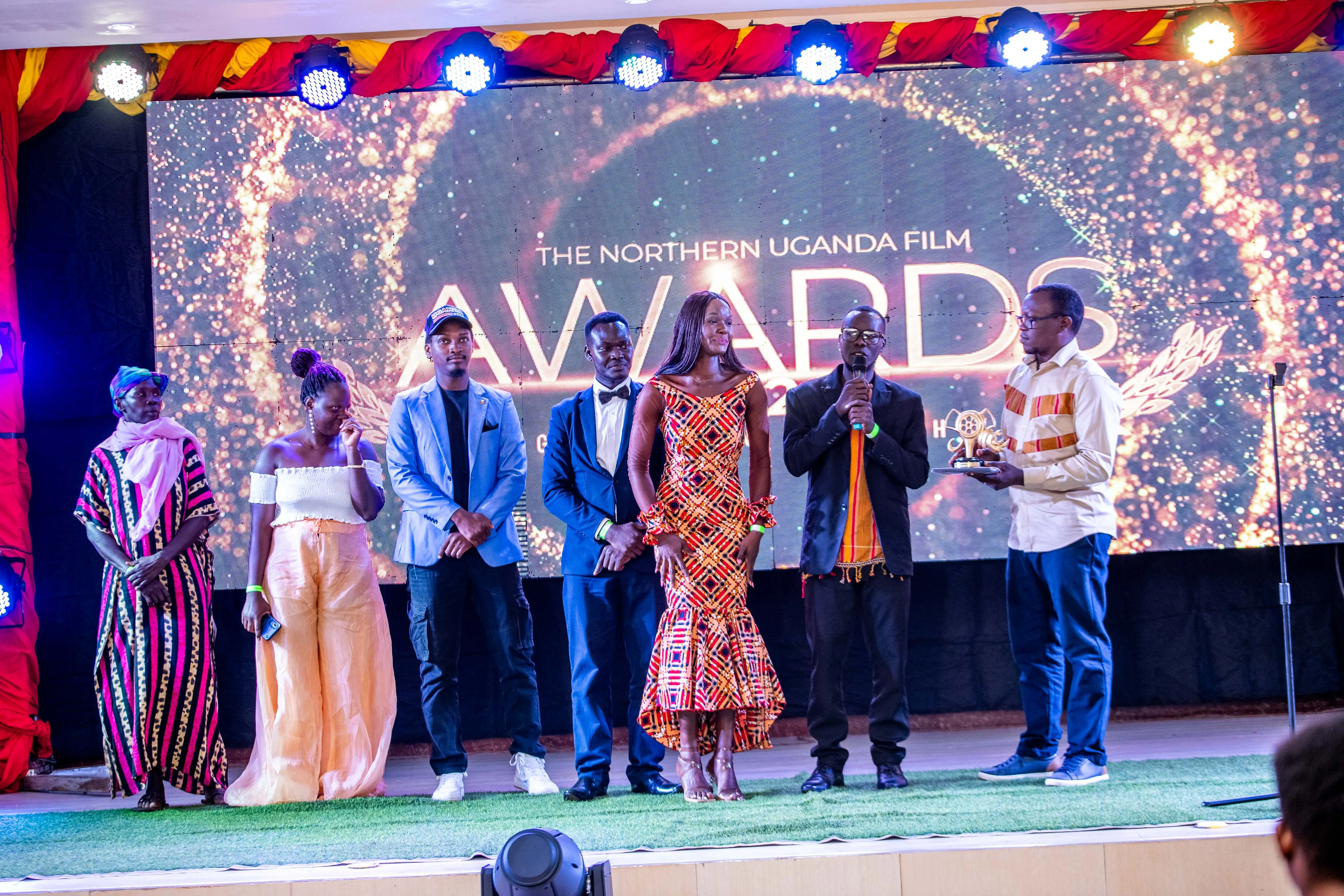 Winners celebrate on stage at the Northern Uganda Film Awards